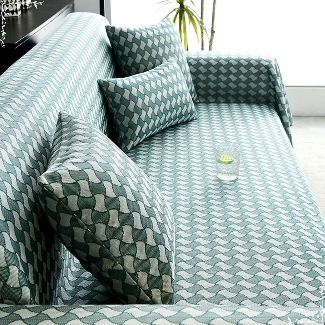 Copridivano verde e bianco con motivo geometrico