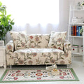 Copridivano beige con motivi floreali