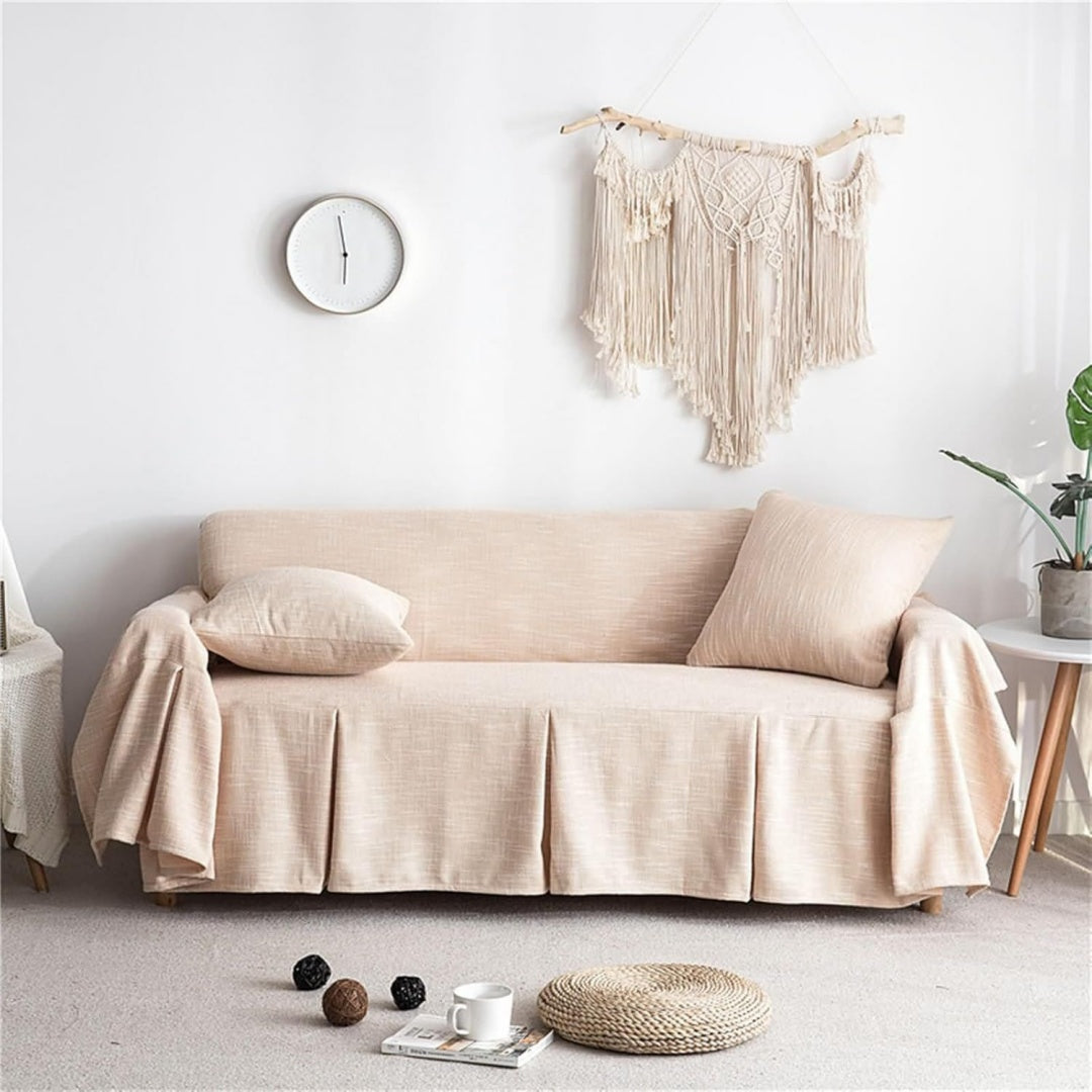 Copridivano beige con bordo a volant