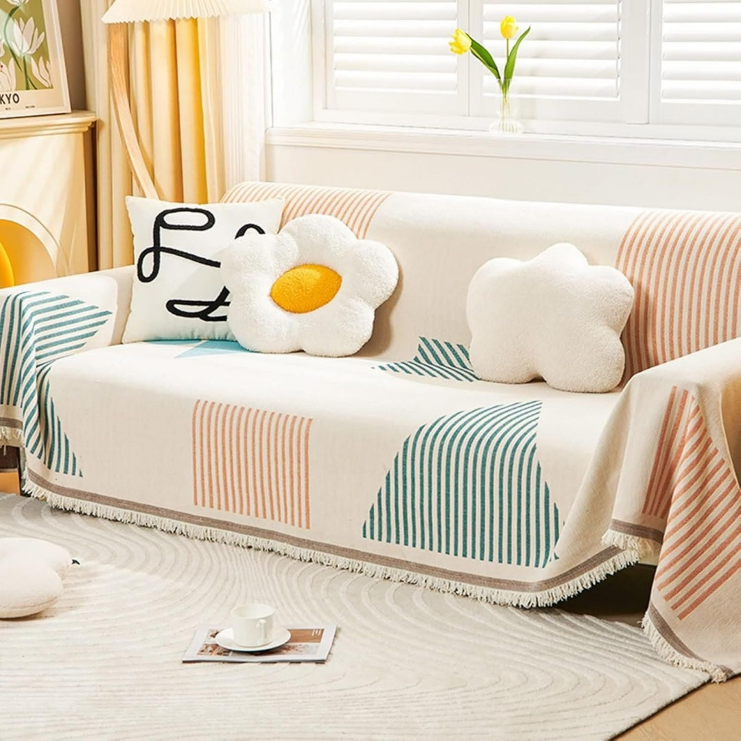 Copridivano beige con righe verdi e arancioni